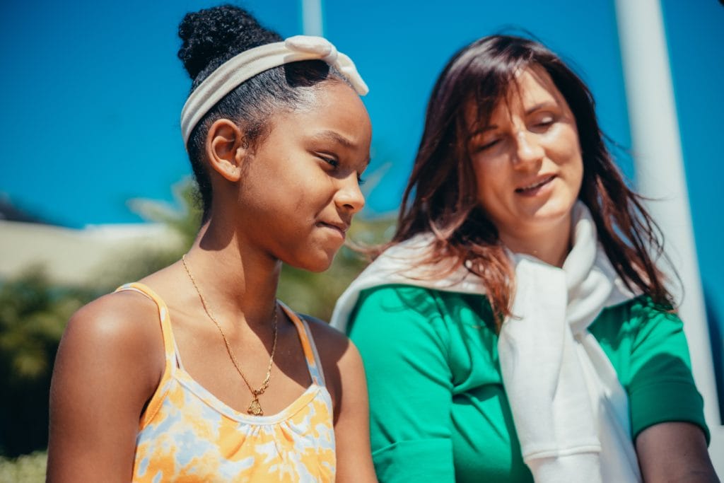 A woman sat with a young girl