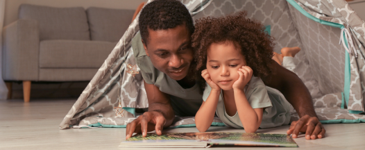 Dad reading with his child